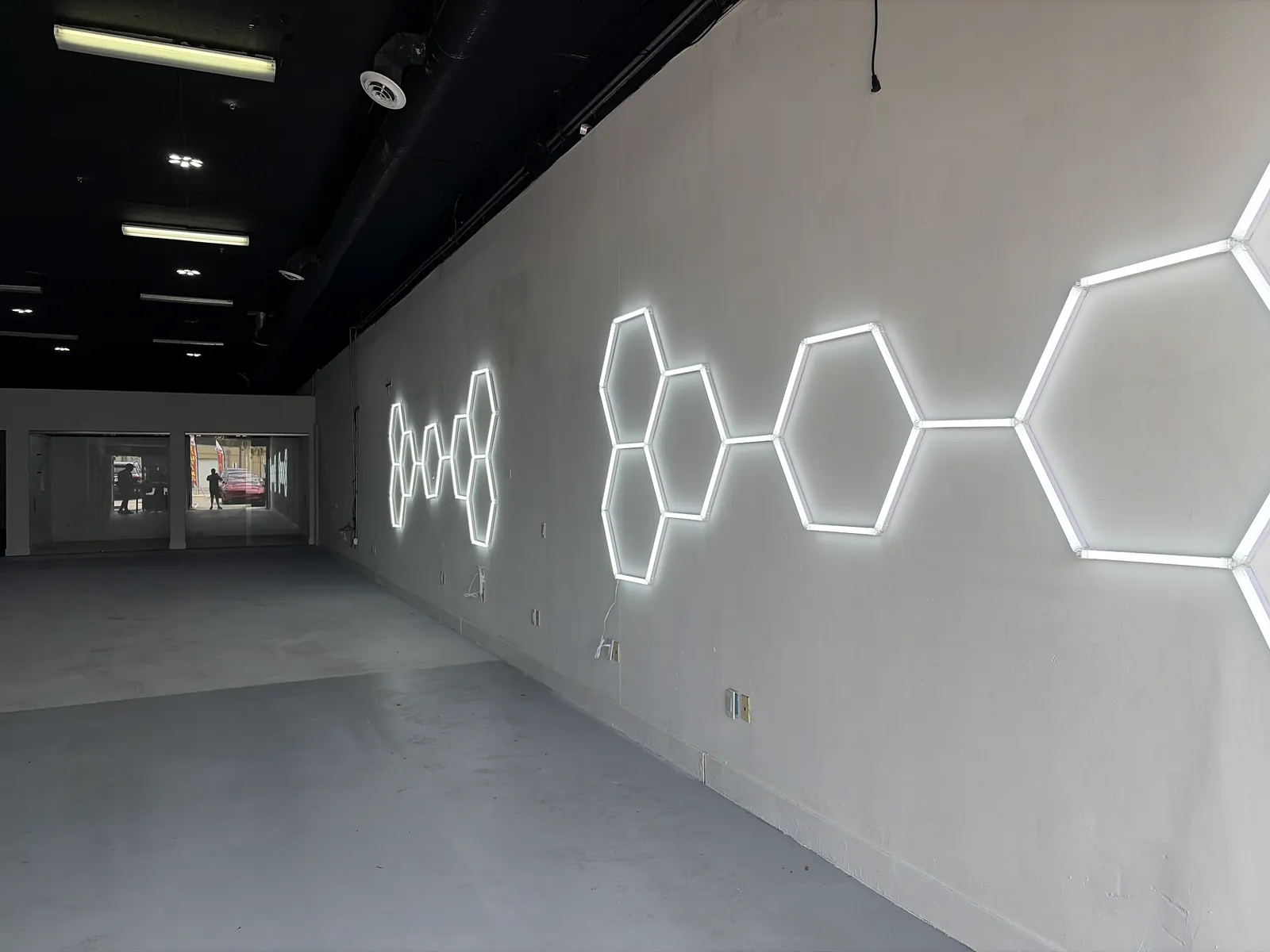 Inside the bay: white walls and the honeycomb light wall