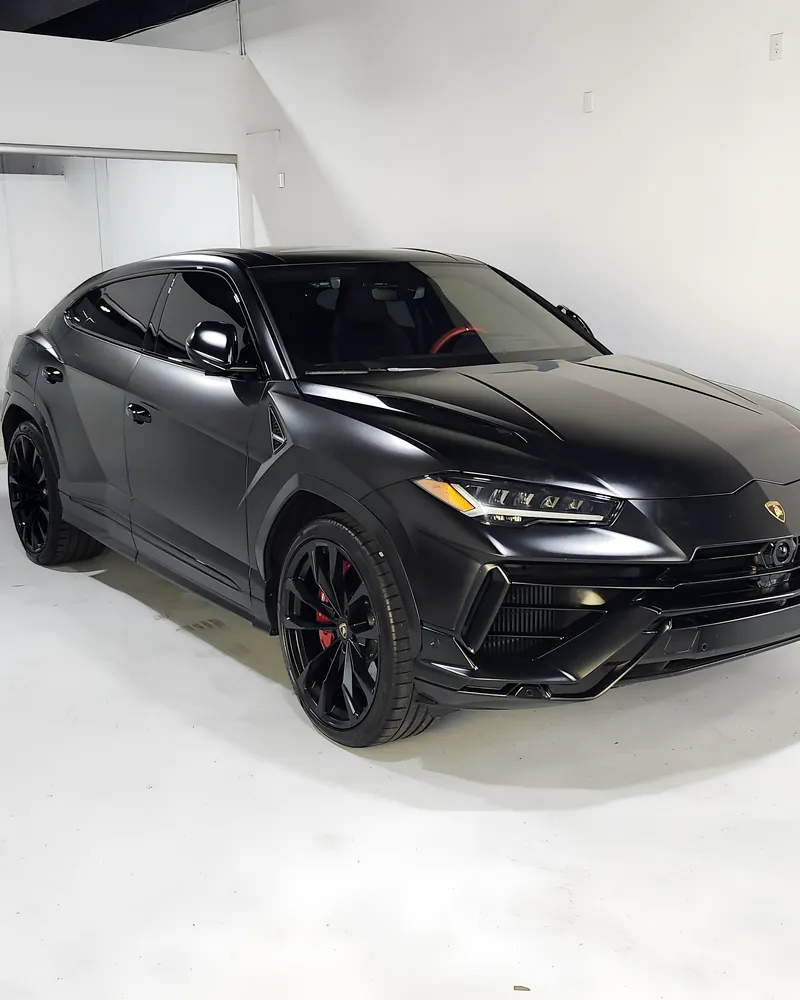Black Lamborghini Urus in the white bay