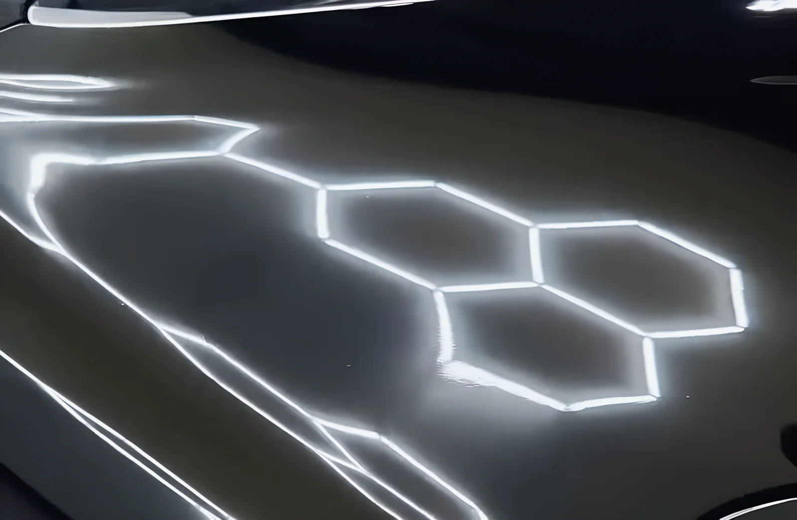 The hexagon lights reflected sharp in black paint after a ceramic coating