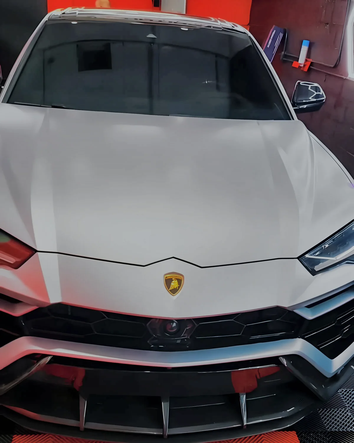 White Lamborghini Urus, front, before the wrap