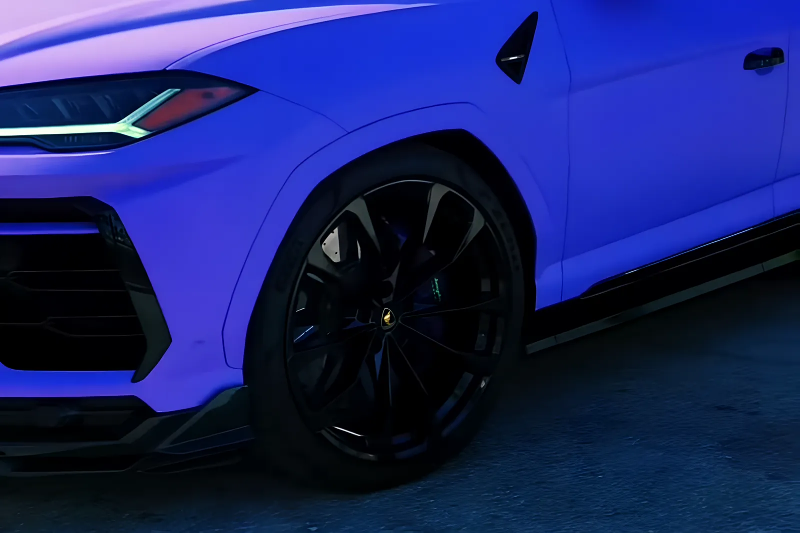Front of the purple Urus and its black wheel