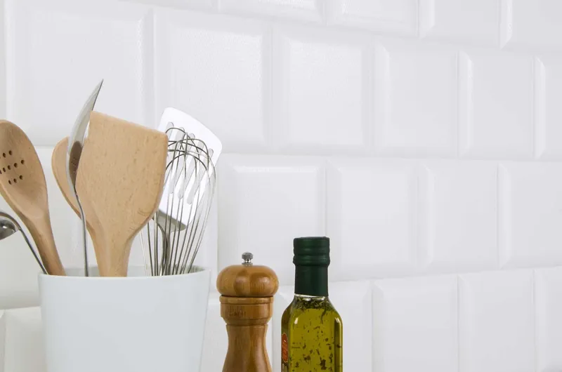 A bright white bevelled subway tile wall