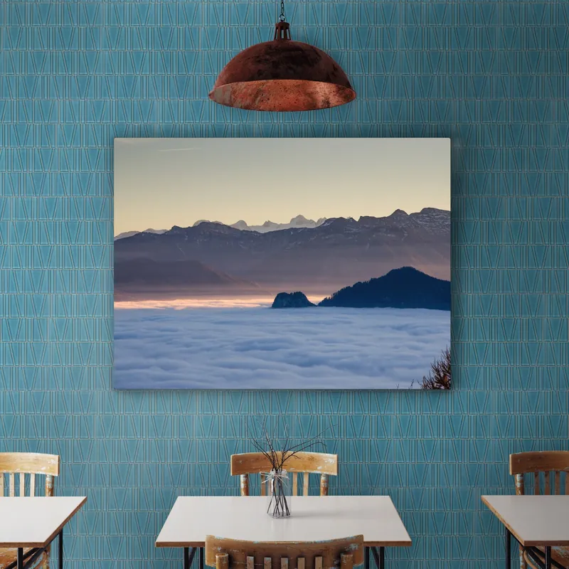 A café wall clad in turquoise geometric glass tile