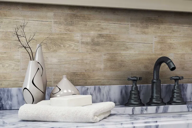 A wood-look plank tile wall above a grey marble counter