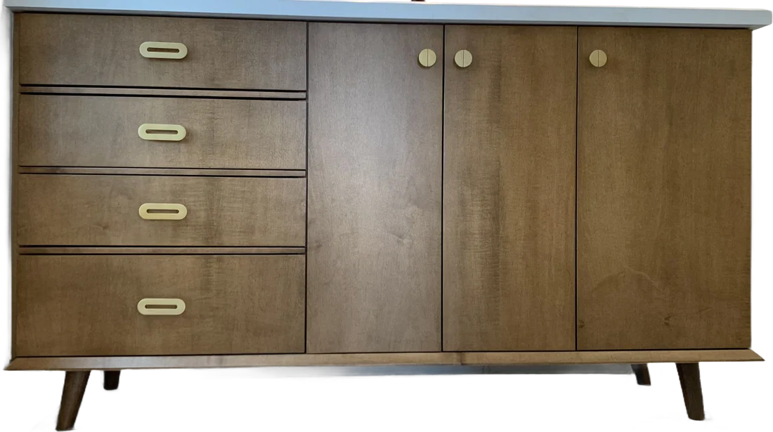 A stained vanity on tapered legs: four drawers with brass oval pulls and three doors with round brass knobs, under a white stone top.